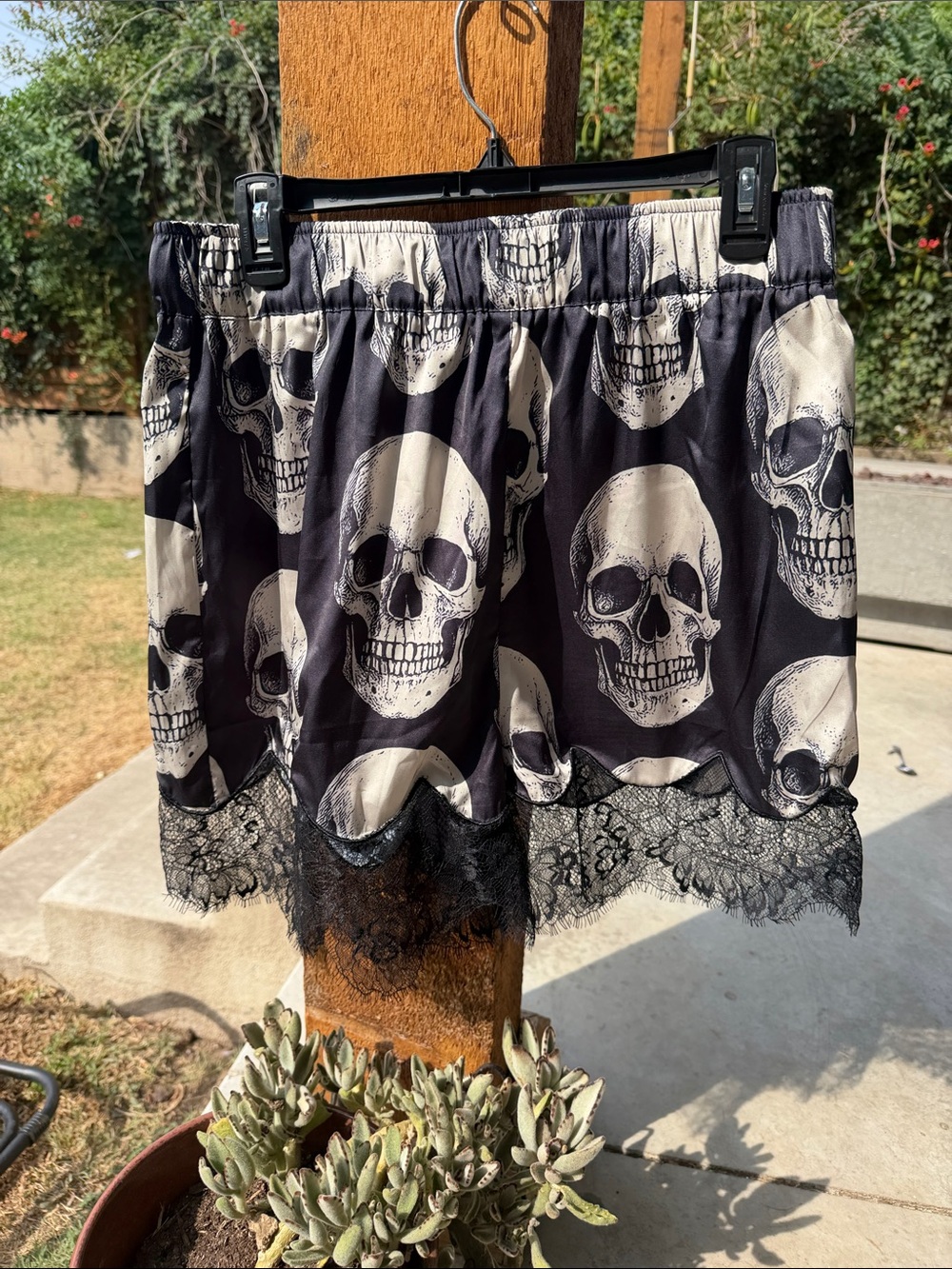 Dressed in LALA Black Mini Skirt with Ivory Skull Print